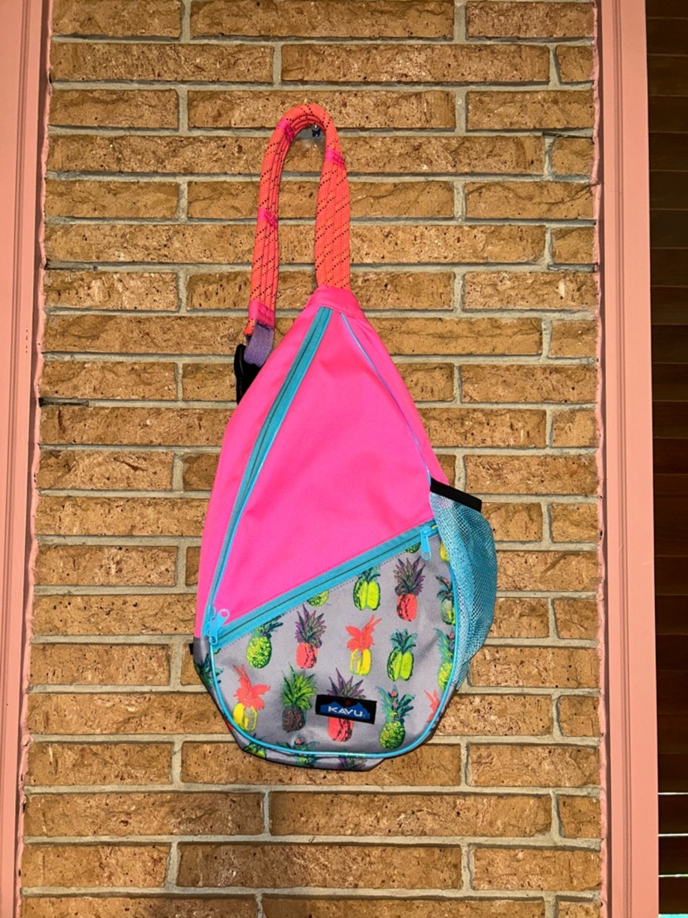Kavu Pink Sling Bag with Teal Accents and Pineapple Print